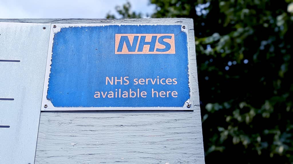 Closed sign on the door of a UK NHS GP surgery during practice closure