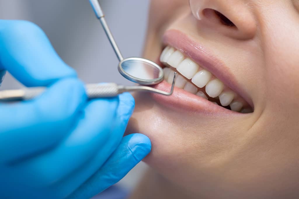 Dentist treating a patient during a private dental appointment at a UK practice