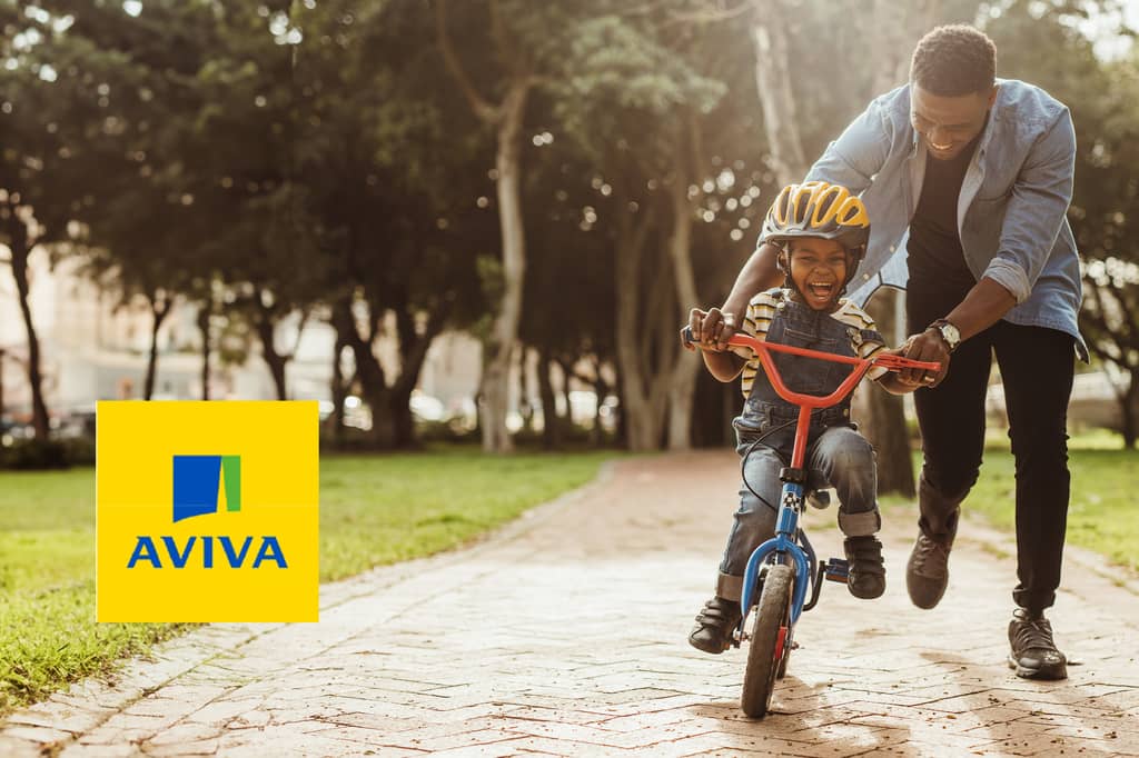 Father teaches his son to ride a bike in a park, with the Aviva logo overlaid