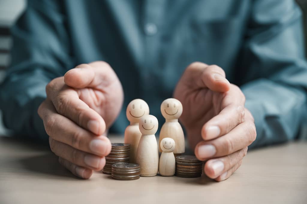 Couple discussing placing their life insurance in trust with an adviser