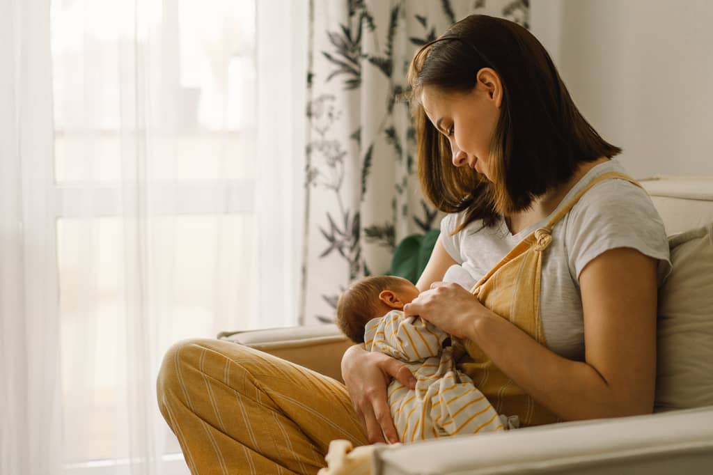 Young family at home considering whether they need life insurance cover