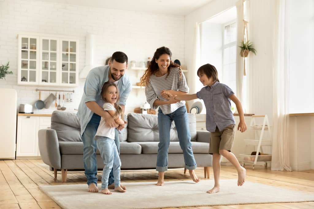 Young family at home learning how family income benefit provides a regular income