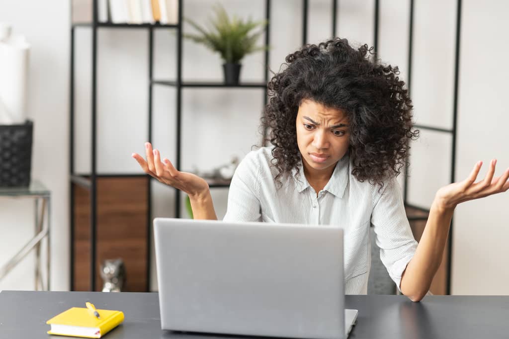 Person reading about waiver of premium on a life insurance policy