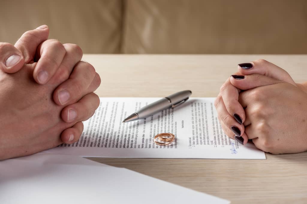 Person reviewing and updating their life insurance policy after a divorce