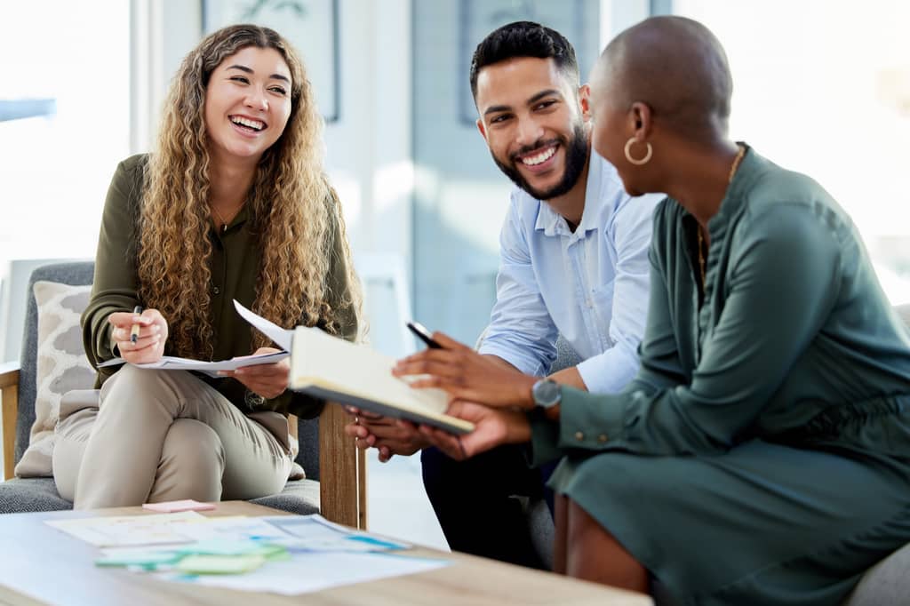 Employee reviewing death in service benefit and life insurance documents at work