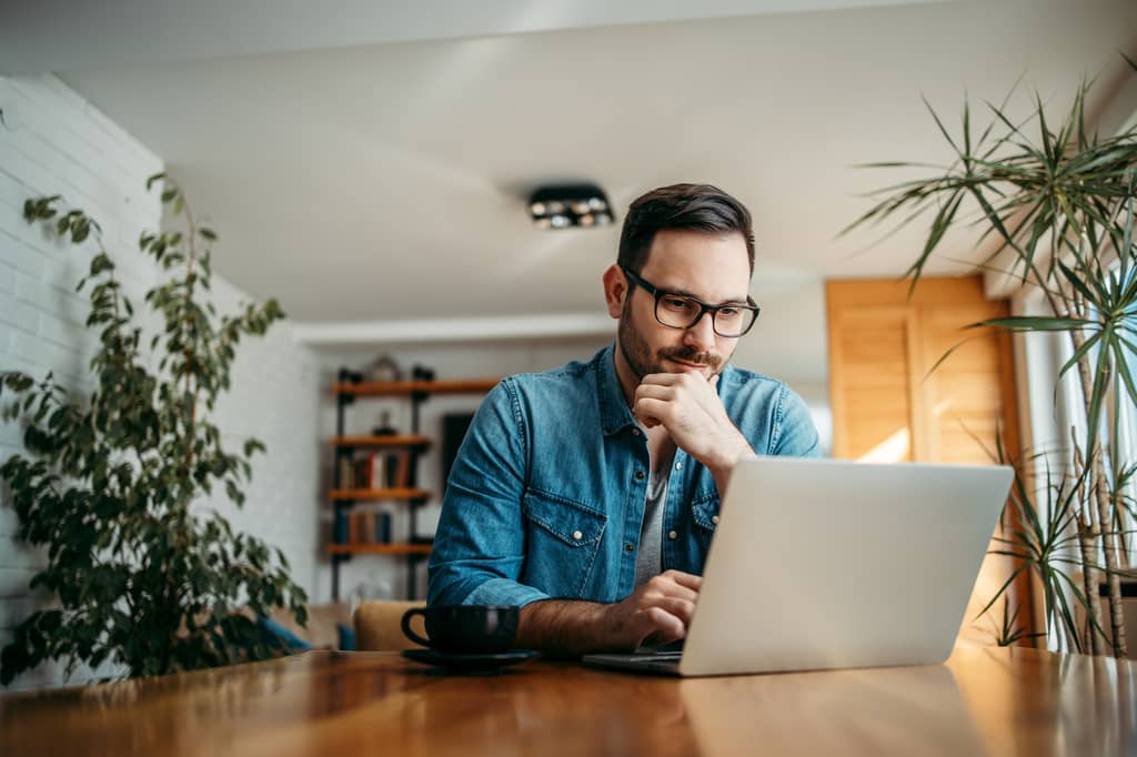 Person reading the exclusions section of a life insurance policy