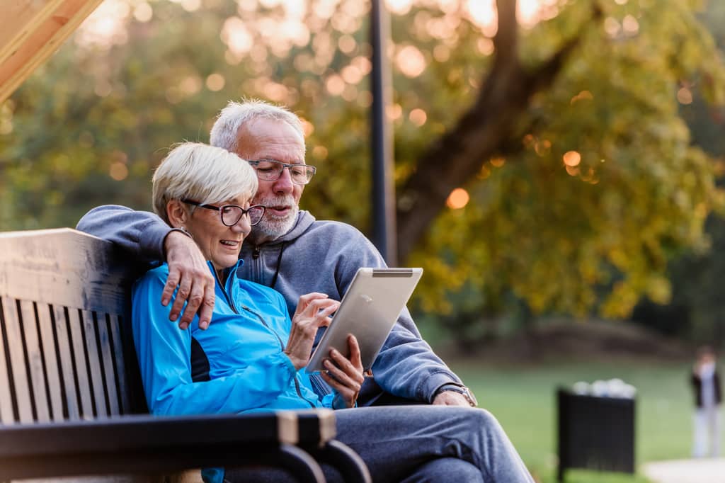Senior couple reviewing their life insurance options together at home