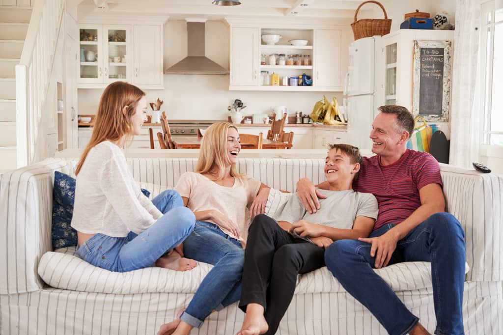 Couple discussing a level term life insurance policy at a kitchen table