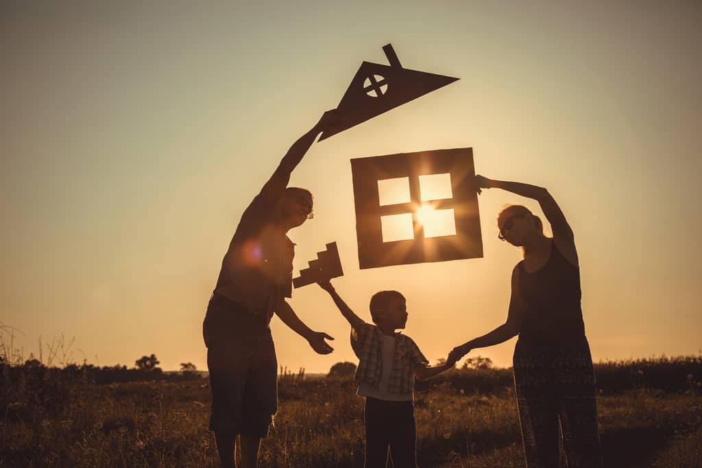 Young family at home discussing the benefits of having life insurance